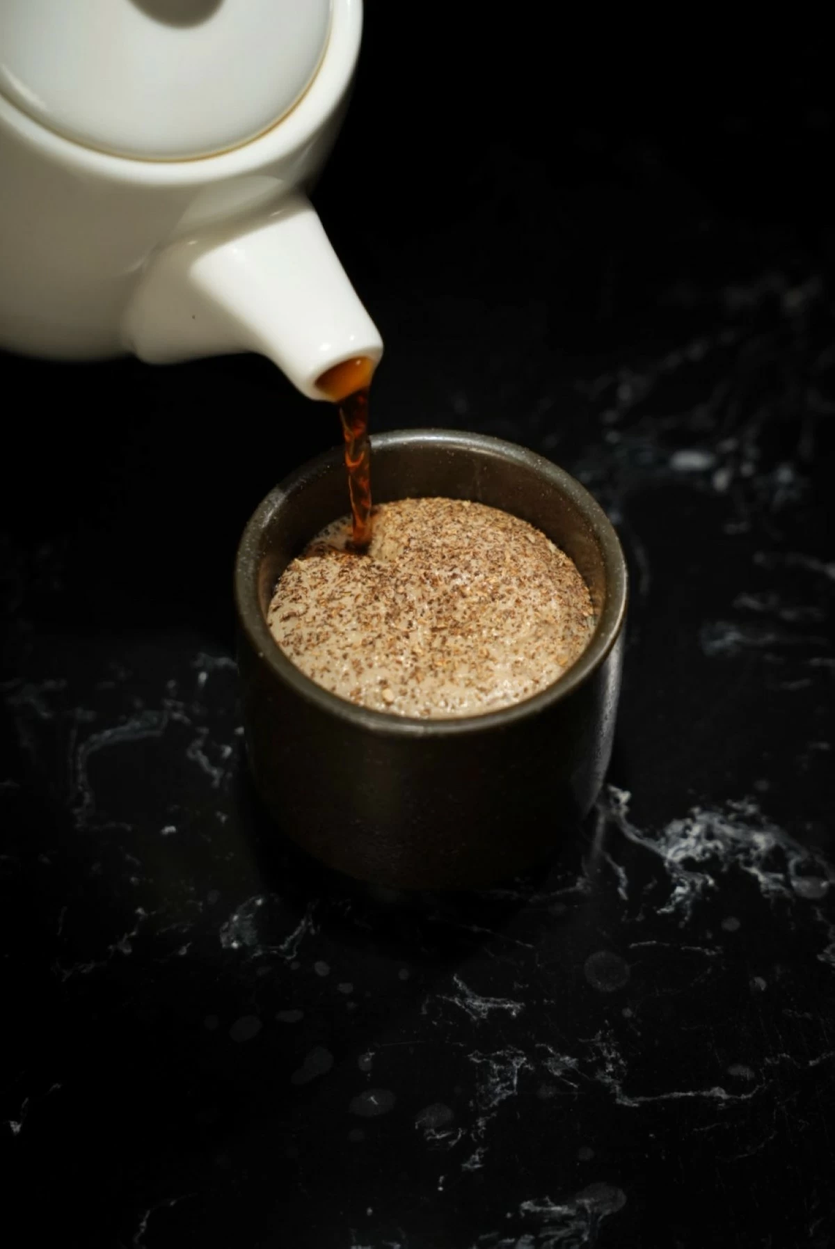 GROUND NOTE Mushroom tea with mushroom espuma and Cordilleran truffle, a quiet midpoint in the progression of courses