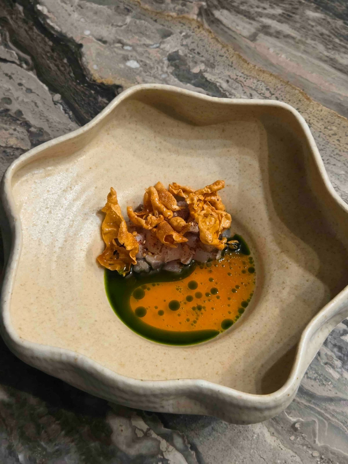 SMOKED LINE  Smoked red snapper paired with fermented coffee tea, saffron emulsion and sea crisp.