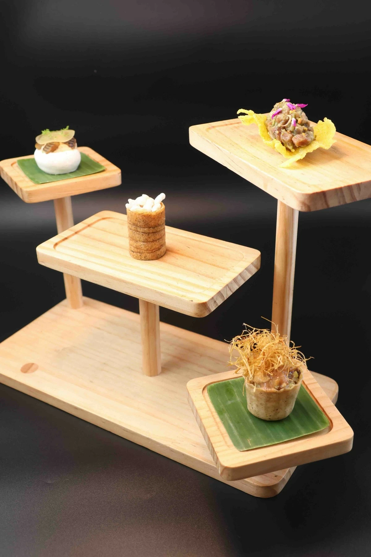 OPENING NOTES Cured General Santos tuna; durian nori roll with gulai tempoyak, kaffir lime and kamias gel; Bago River eel with green apple meringue and foie gras; and Angus beef tartare with smoked crying tiger flavors and spiced rice crackers.