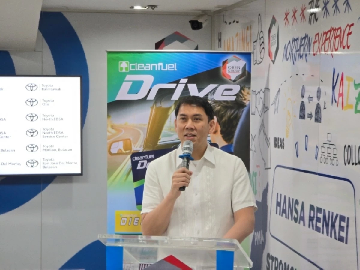 Cosco Oben, President of the Oben Group of Companies, explains the partnership to members of the media