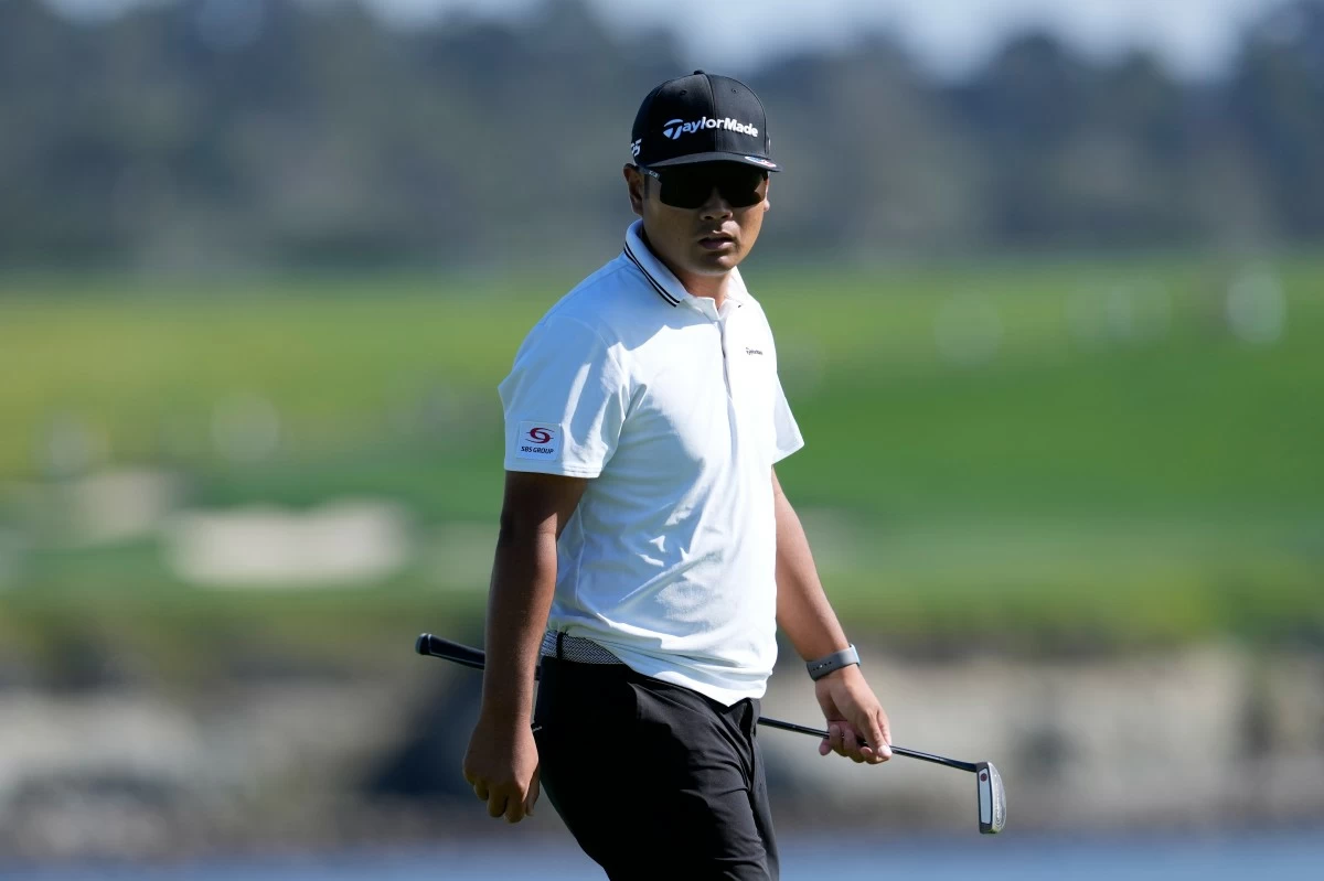 Ryo Hisatsune, from Japan, walks on the 17th green at Pebble Beach Golf Links during the first round of the AT&T Pebble Beach Pro-Am golf tournament in Pebble Beach, Calif., Thursday, Feb. 12, 2026. (AP Photo/Godofredo A. Vásquez)