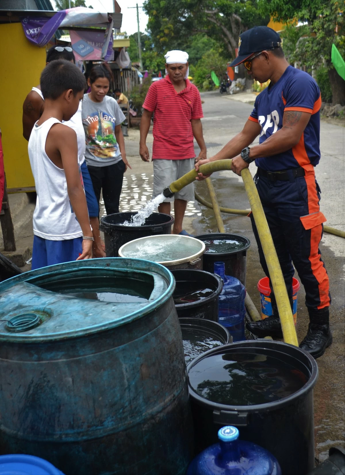 With no water coming from faucets, rationing becomes the only option.