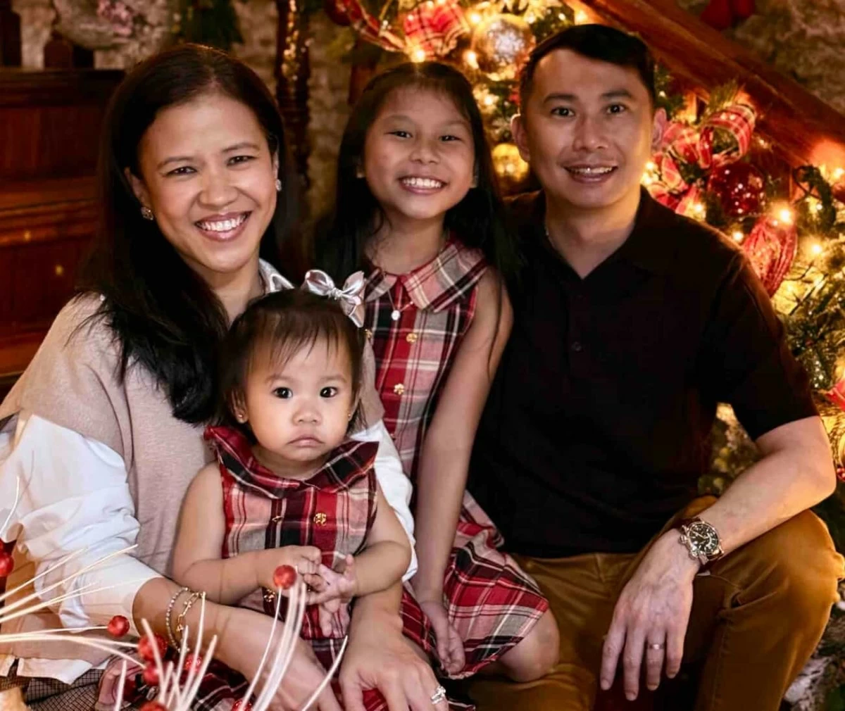 Apple with husband Quincy, and their daughters Isabelle, 10, and Iliana, 1
