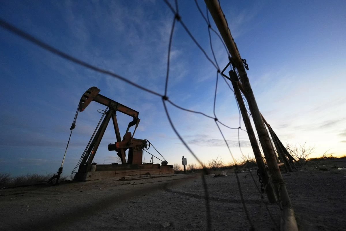 FILE - A pumpjack is visible before sunrise Feb. 26, 2025, in Kermit, Texas. (AP Photo/Julio Cortez, File)