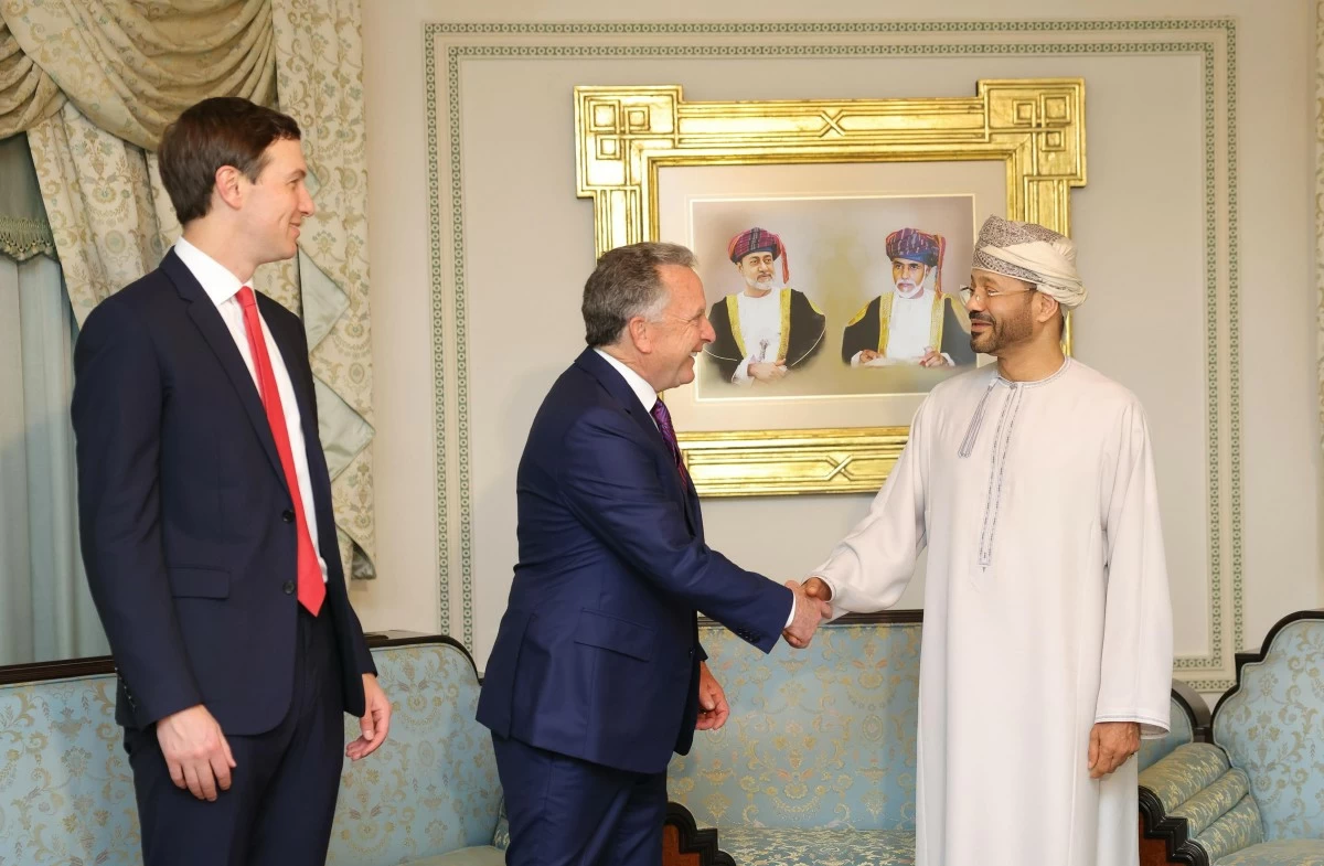 FILE - In this photo released by the Oman's Foreign Ministry, Steve Witkoff, White House special envoy, center, shakes hands with Oman's Foreign Minister Sayyid Badr Albusaidi, accompanied by Jared Kushner, left, during a meeting prior to Iran and U.S. negotiations in Muscat, Oman, Friday, Feb. 6, 2026. (Oman Foreign Ministry via AP, File)
