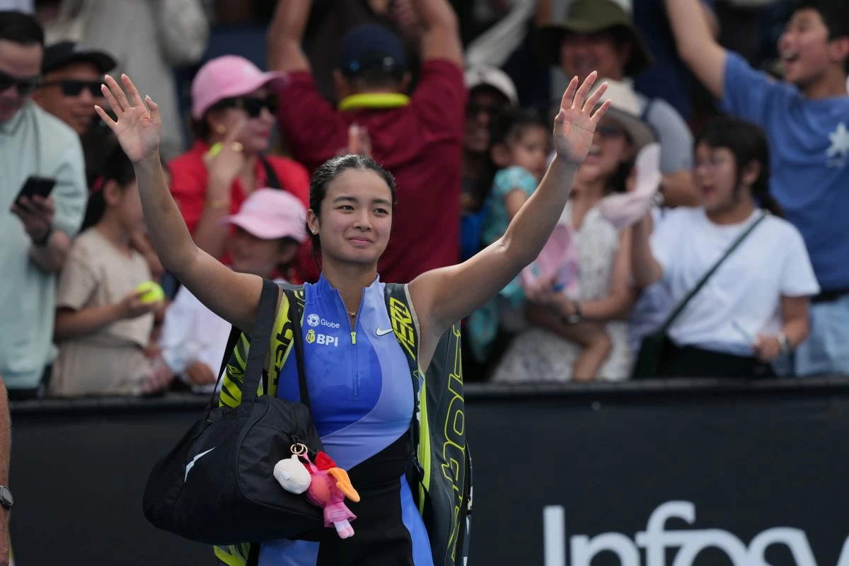 Alexandra Eala of the Philippines waves to her supporters following her first round loss to Alycia Parks of the U.S. at the Australian Open tennis championship in Melbourne, Australia, Monday, Jan. 19, 2026. (AP Photo/Dar Yasin))