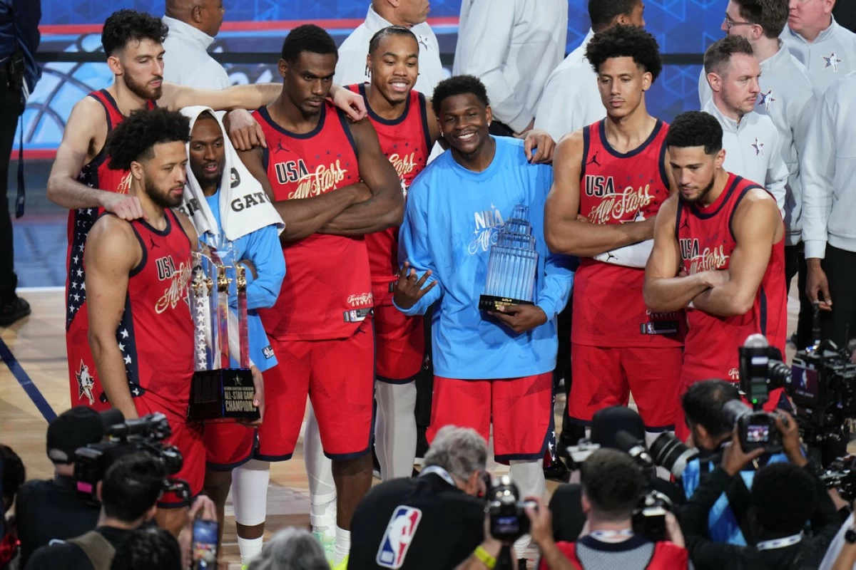 USA Stars pose for photos after a win over USA Stripes in the NBA All-Star basketball game Sunday, Feb. 15, 2026, in Inglewood, Calif. (AP Photo/Jae C. Hong)