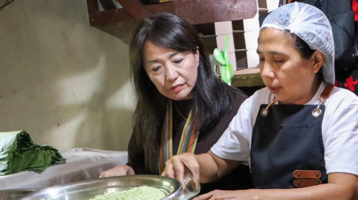 Mme. Akiko Endo discovering traditional methods of local delicacy preparation

