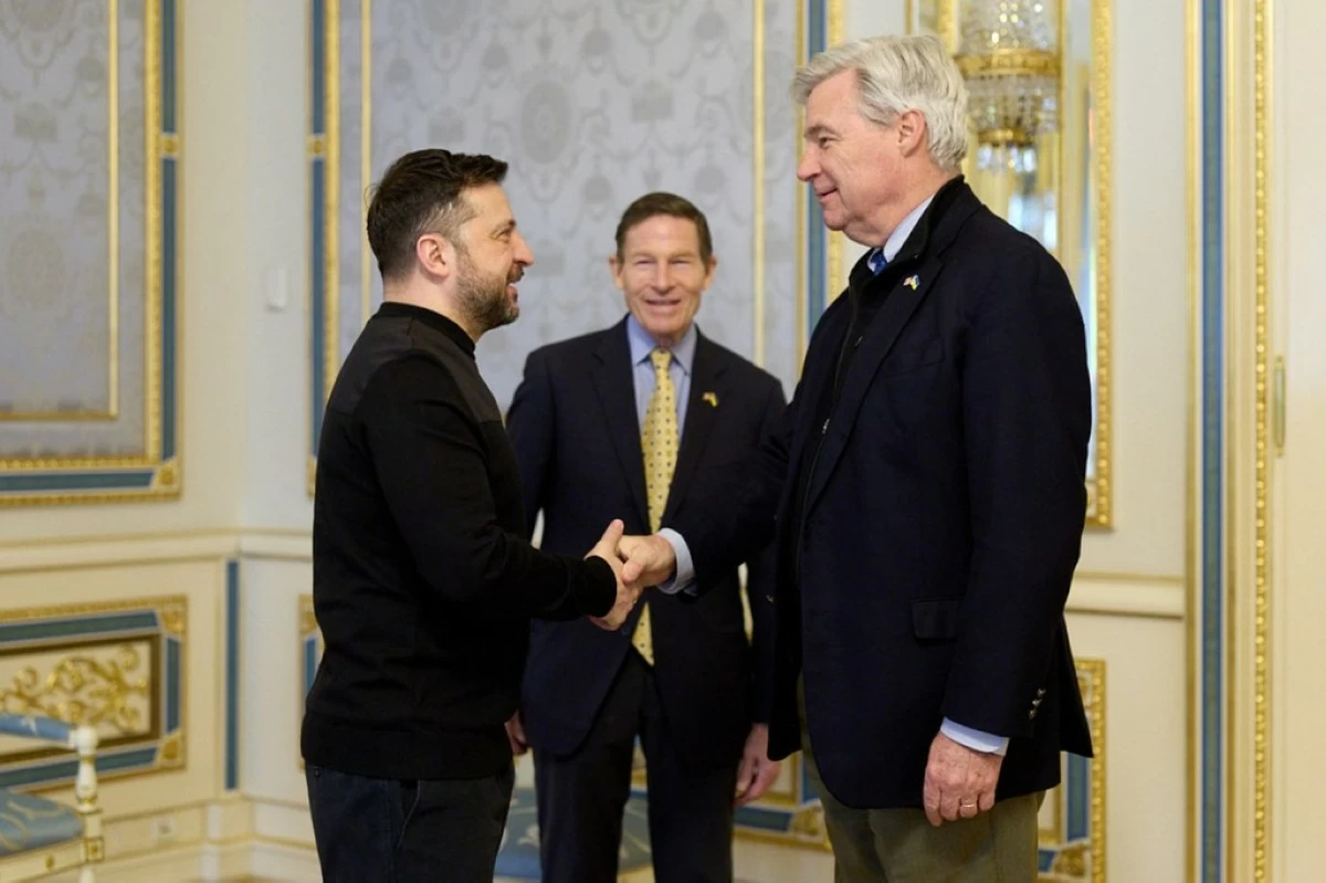 In this photo provided by the Ukrainian Presidential Press Office, Ukrainian President Volodymyr Zelenskyy, left, greets Sen. Sheldon Whitehouse D-R.I. and Sen. Richard Blumenthal, D-Ct., center, in Kyiv, Ukraine, Monday, Feb. 16, 2026. (Ukrainian Presidential Press Office via AP)