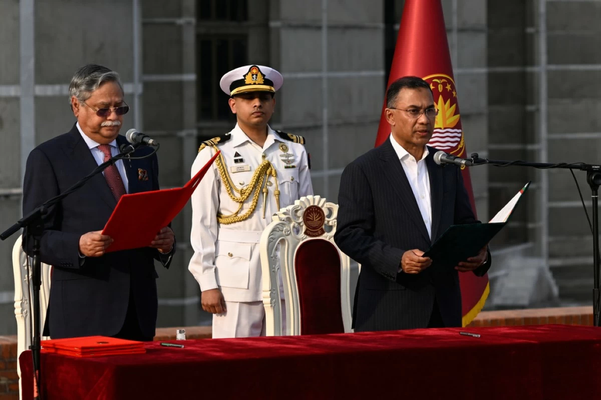 Tarique Rahman, Chairperson of the Bangladesh Nationalist Party, takes oath as Prime Minister of Bangladesh from President Mohammed Shahabuddin, left, at the National Parliament in Dhaka, Bangladesh, Tuesday, Feb.17, 2026. (AP Photo/Mahmud Hossain Opu)