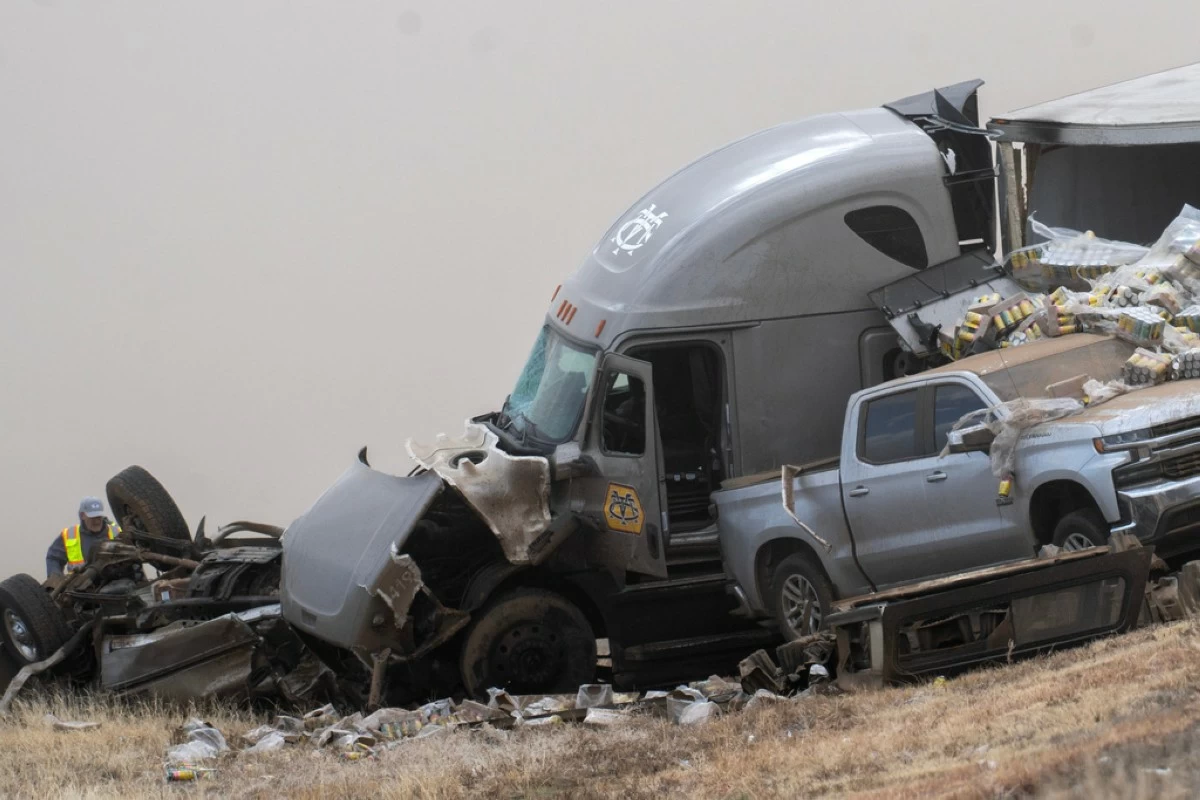 Emergency personnel work the scene of a crash involving 30-plus vehicles including six semi trucks on Interstate 25 south of Pueblo, Colo., on Tuesday, Feb. 17, 2026. (Christian Murdock/The Gazette via AP)