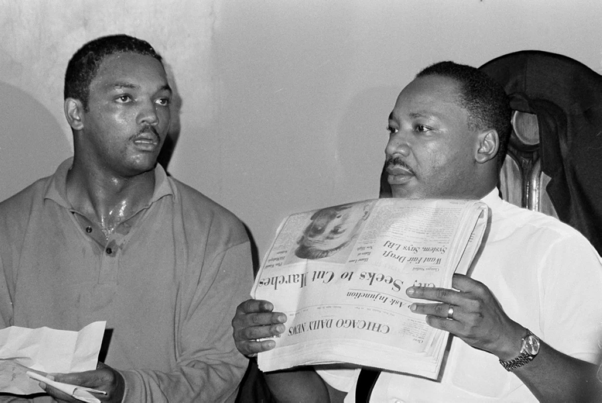 Civil rights leader Dr. Martin Luther King, Jr., right, and his aide Rev. Jesse Jackson are seen in Chicago, Aug. 19, 1966. (AP Photo/Larry Stoddard, File)