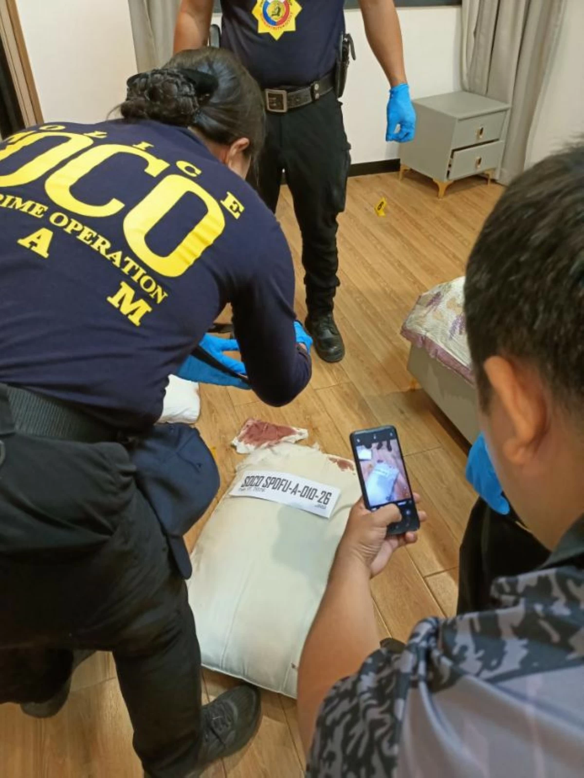 Scene of the Crime Operatives investigate the crime scene. (Photo from Pasay City Police)