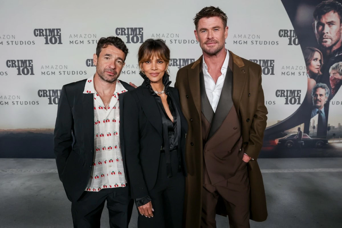 Bart Layton, Halle Berry, and Chris Hemsworth attend the Amazon MGM 'Crime 101' world premiere on Feb. 10, 2026, at The United Theater in Los Angeles. (Columbia Pictures)