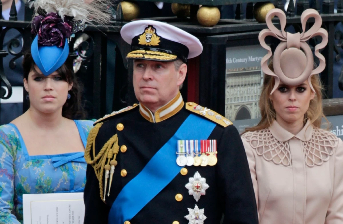 Britain's Prince Andrew, center, and his daughters Princess Eugenie, left, and Princess Beatrice leave Westminster Abbey after the wedding of Prince William to Catherine Middleton, in London, April 29, 2011. (AP Photo/Gero Breloer, File)
