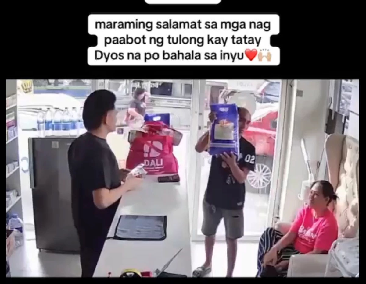 Pharmacy aid Jim Soriano hands over the groceries and cash donations from netizens to the driver who pawned his license at a drug store in Imus City (Screenshot from Jim Soriano's Facebook reel/MANILA BULLETIN)