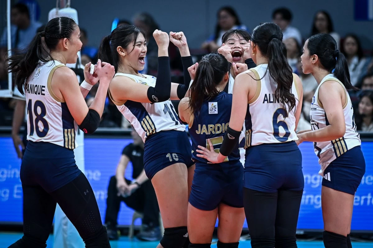 National University players celebrate after scoring a point against FEU. (UAAP Images)