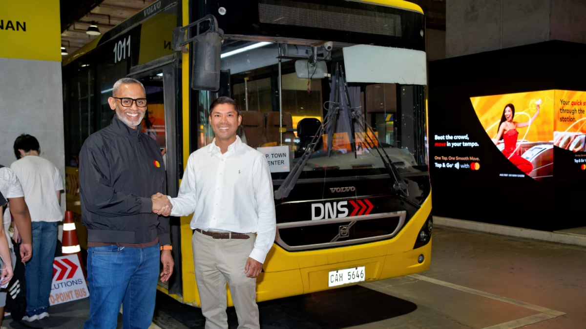 Jason Crasto, country manager for the Philippines at Mastercard Inc., left, and Steeve Mago, chief executive officer of Delta NeoSolutions Inc., mark the launch of contactless “Tap & Go” payments for point-to-point buses in Metro Manila. 