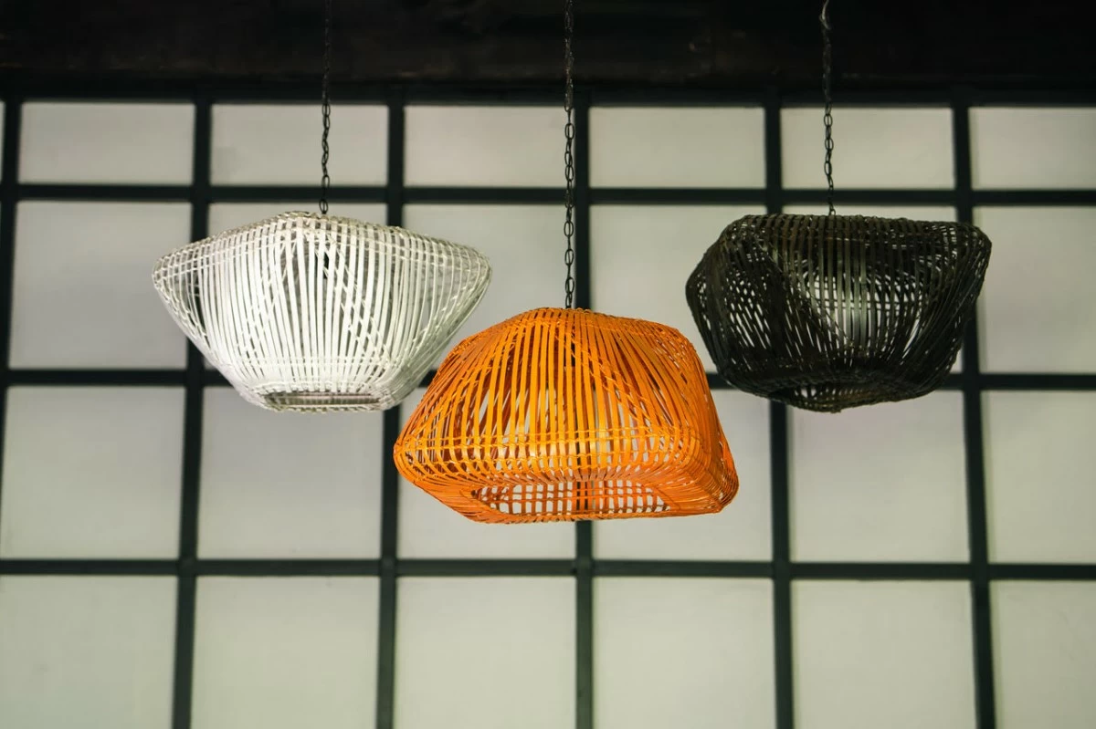 Biscornu hanging lamps in split bamboo are inspired by stuffed ornamental pin cushions and were designed by Rita Nazareno and Gabby Lichauco.