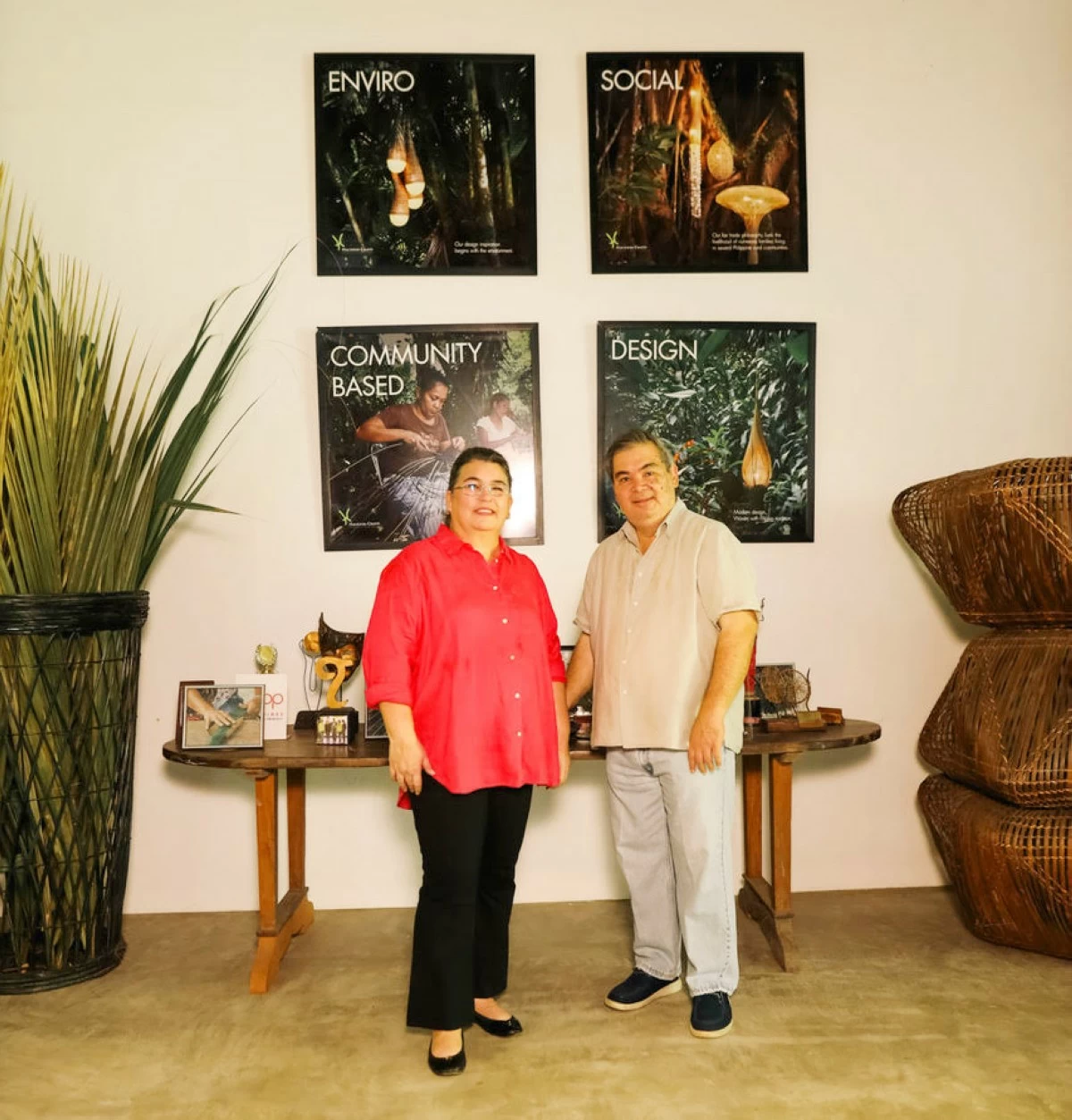 Christina Borromeo-Gaston and Joey Gaston are at the Hacienda Crafts central workshop in Manapla, Negros Occidental, with their company values—enviro, social, design, and community—on display.