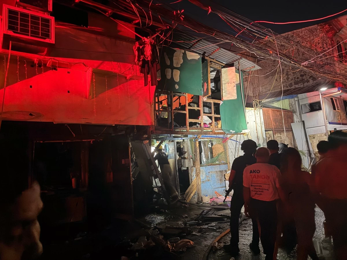 Firefighters continue to extinguish the fire that razed hundreds of houses in Barangay 655, Intramuros, Manila, on Wednesday, Feb. 25. (Photo courtesy of Diann Calucin)