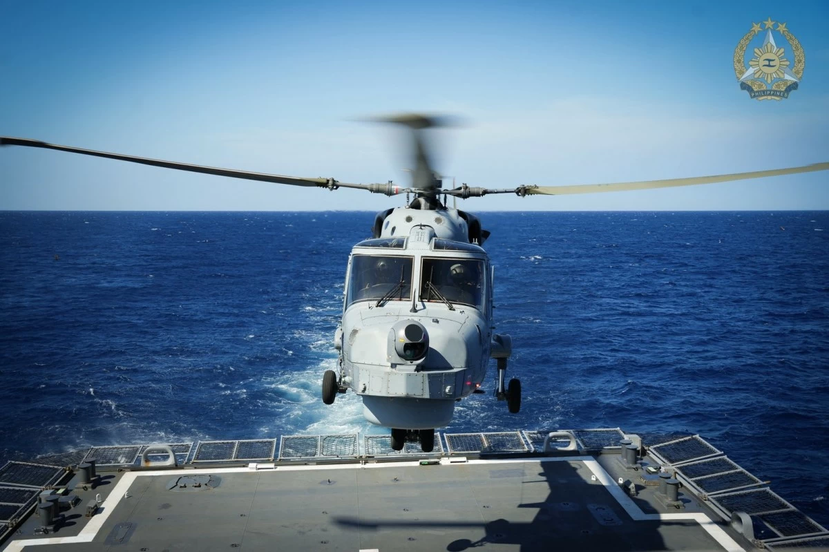 The Philippine Navy’s AW159 helicopter executes a cross-deck landing during the 15th Multilateral Maritime Cooperative Activity (MMCA) in the West Philippine Sea, held from February 20 to 26, 2026. (Photo: Armed Forces of the Philippines)