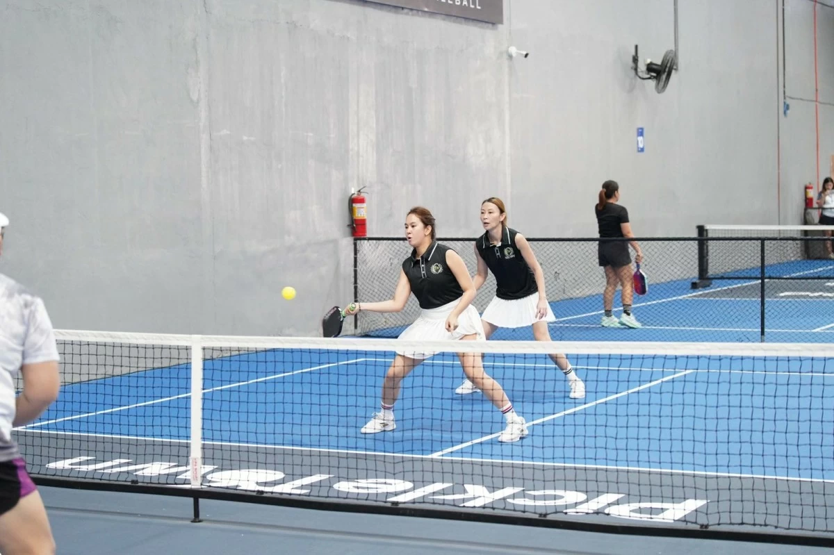 Patricia Calma and Rochelleen Quibingco move in perfect sync as they set up a return during their match in the 35+ High Intermediate women’s doubles.