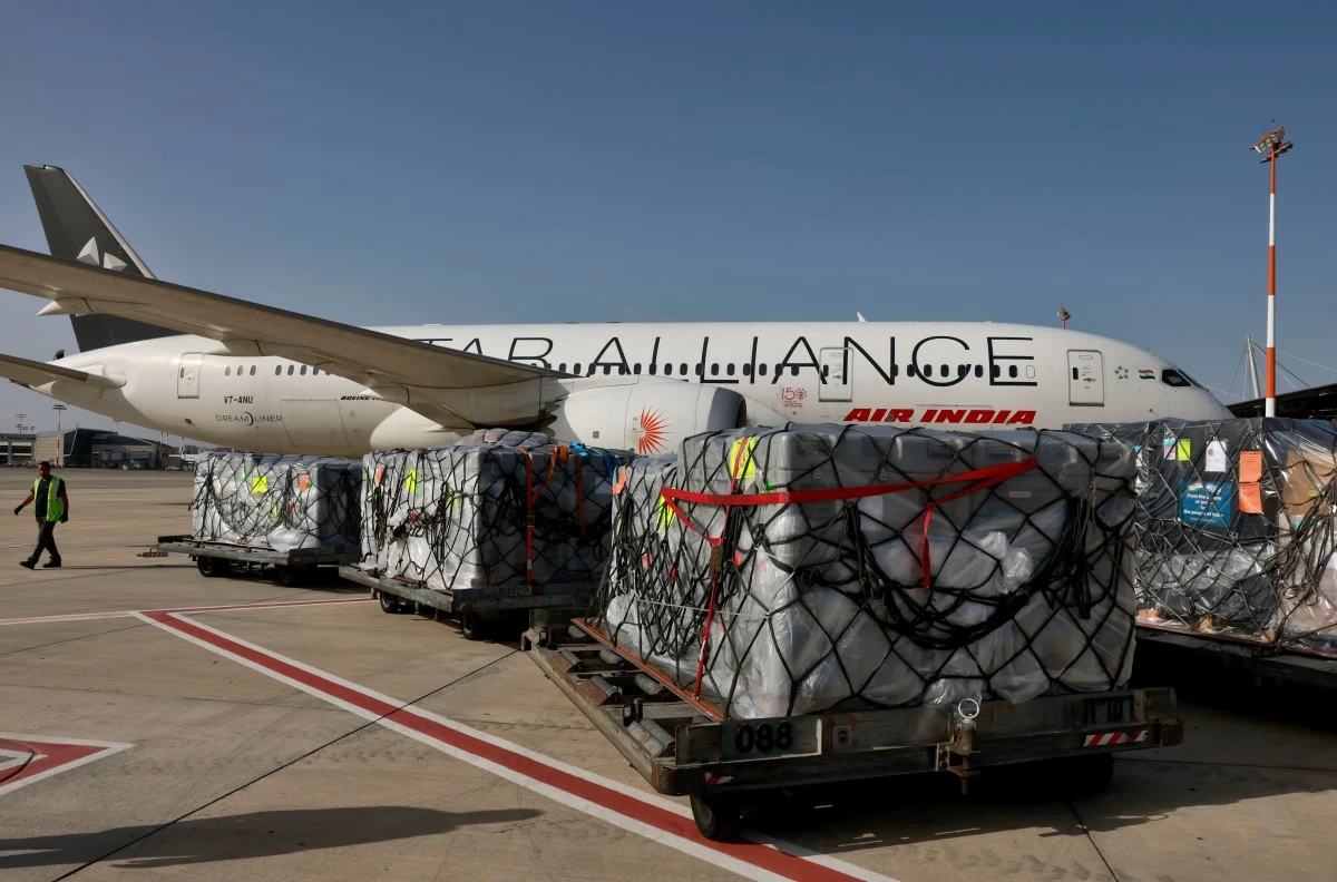 
WORKERS load medical aid onto an Air India plane to be flown to India at Ben Gurion Airport near Tel Aviv, Israel, May 4, 2021. (AP)
