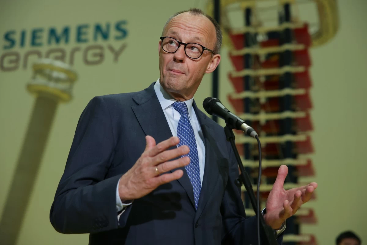 German Chancellor Friedrich Merz speaks before media members as he visits facilities of Siemens Energy during his official visit, in Hangzhou, China, Thursday, Feb. 26, 2026. (Andres Martinez Casares/Pool Photo via AP)