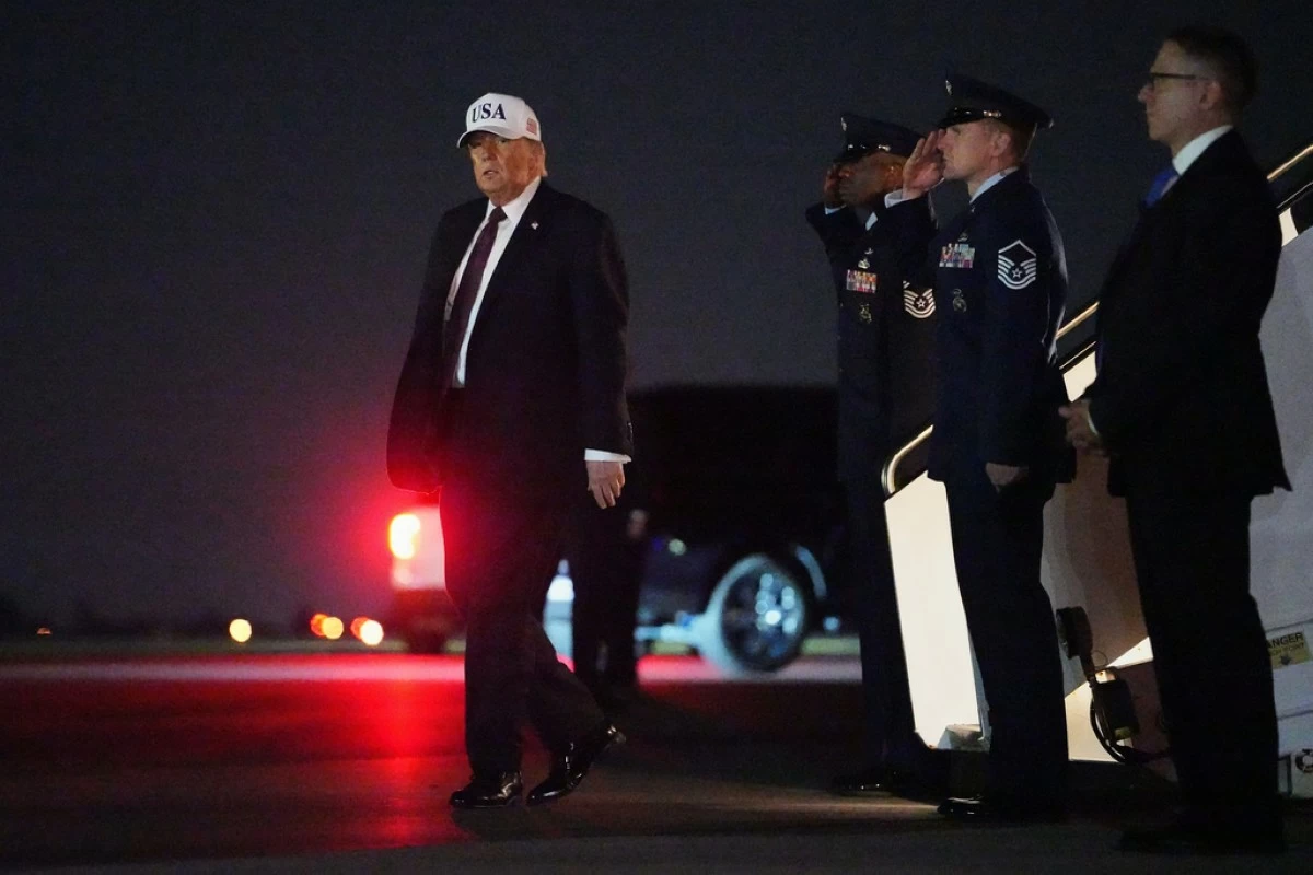 President Donald Trump disembarks Air Force One at Palm Beach International Airport in West Palm Beach, Fla., Friday, Feb. 27, 2026. (AP Photo/Matt Rourke)