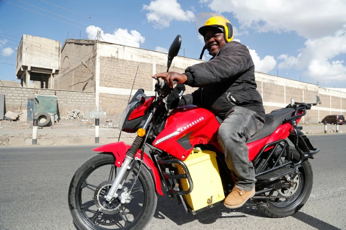 FILE -A man rides an electric motorcycle from Ampersand on a test drive in Nairobi, Kenya, Jan. 23, 2023. (AP Photo/Brian Inganga, File)