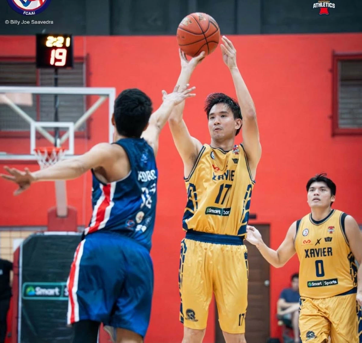 Charles Tiu goes for a jumper.