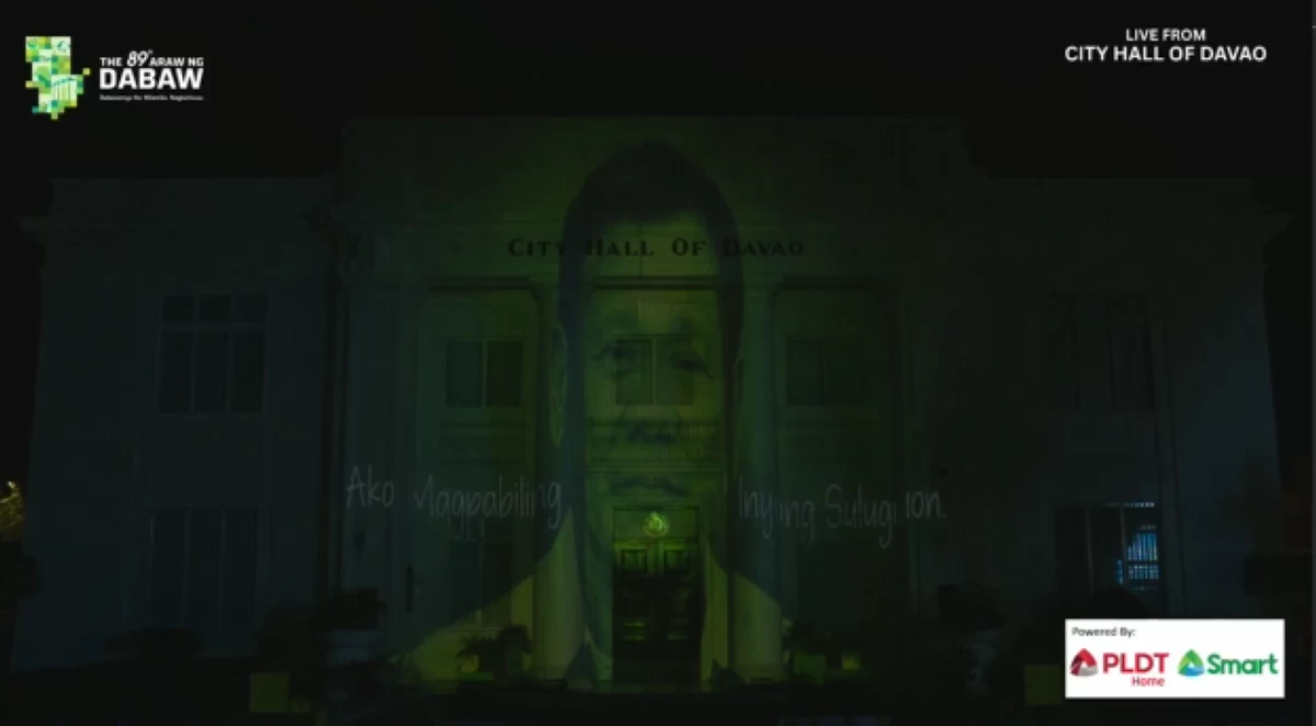 THE face of former Davao City Mayor and President Duterte is projected into the Davao City during the opening of the 89th Araw ng Dabaw on Sunday night, March 1. (Photo via Ivy tejano)