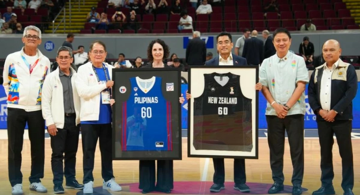 Ahead of their FIBA World Cup Asian Qualifiers clash, Gilas Pilipinas and New Zealand’s Tall Blacks
exchanged commemorative jerseys at center court — a symbolic gesture marking 60 years of
Philippines–New Zealand friendship. In photo (from left): PSC Commissioners Matthew Gaston and
Walter Torres; SBP President Ricky Vargas; New Zealand Ambassador H.E. Dr. Catherine McIntosh; DFA Chief of Protocol Assistant Secretary Ariel Peñaranda; PSC Chairman Patrick Gregorio; and PCO Secretary Dave Gomez