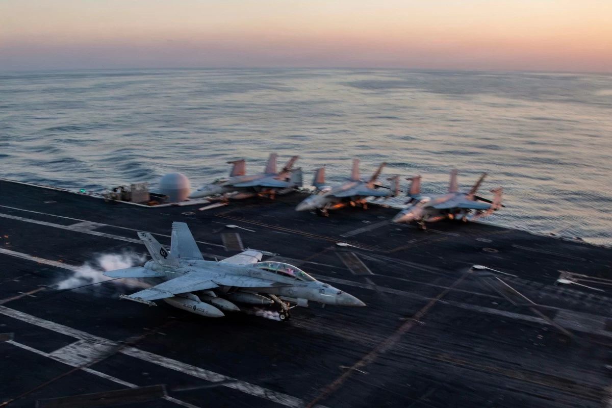 AN F/A-18F Super Hornet prepares to make an arrested landing on the USS Abraham Lincoln (CVN 72) in support of Operation Epic Fury on Saturday, Feb. 28, 2026. (US Navy via AP)