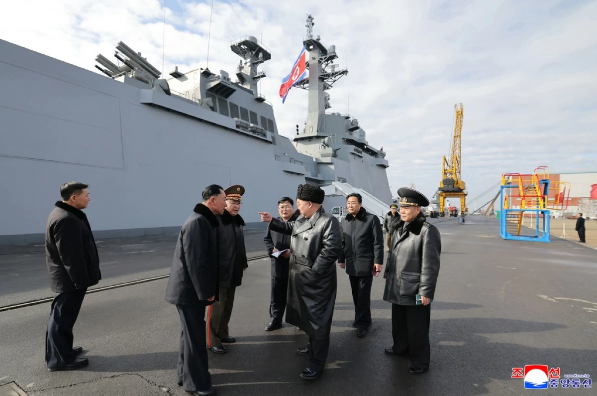 In this photo provided by the North Korean government, its leader Kim Jong Un, center, inspects new destroyer, Choe Hyon ahead of its commissioning at a shipyard in Nampo, North Korea Tuesday, March 3, 2026. (Korean Central News Agency/Korea News Service via AP)