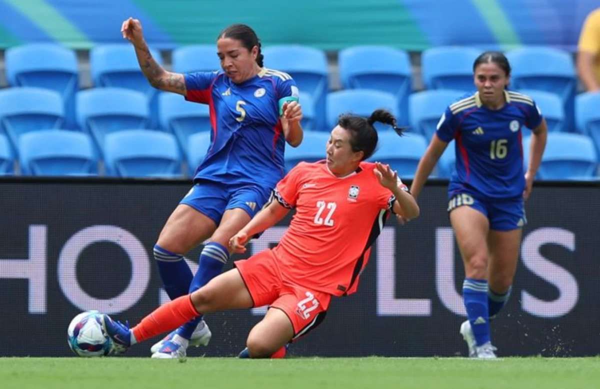 Hali Long, left, challenges South Korea's Choo Hyo-Joo for possession during their match. (AFC)