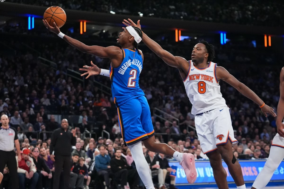 Oklahoma City Thunder's Shai Gilgeous-Alexander (2) drives past New York Knicks' Og Anunoby (8) during the first half of an NBA basketball game Wednesday, March 4, 2026, in New York. (AP Photo/Frank Franklin II)