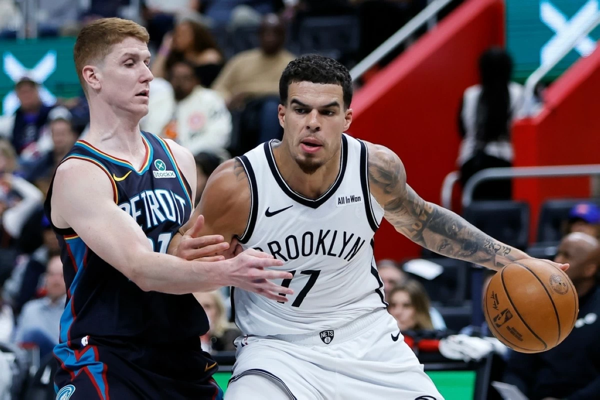 Brooklyn Nets forward Michael Porter Jr. (17) drives with the ball against Detroit Pistons guard Kevin Huerter, left, during the first half of an NBA basketball game Saturday, March 7, 2026, in Detroit. (AP Photo/Duane Burleson)
