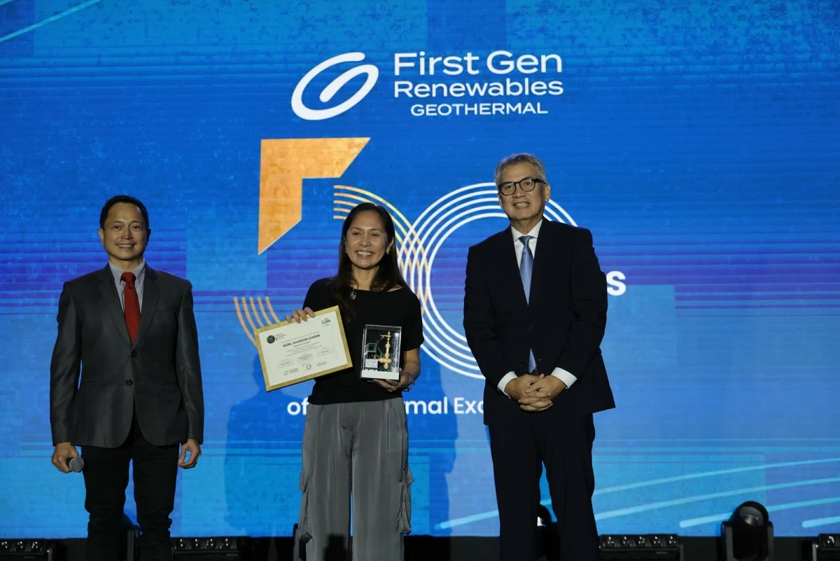 DOE Secretary, Sharon Garin, receives a miniature geothermal wellhead and a Binhi greening legacy certificate from First Gen President and COO, Francis Giles Puno, and EDC President and COO, Jerome Cainglet.