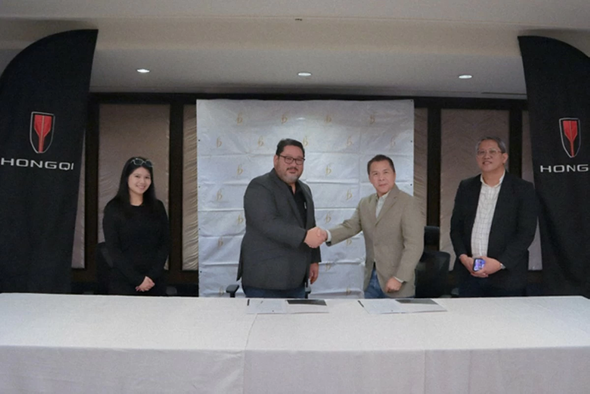 From left: Justine Delacerna, Assistant Director for Group Marketing of The Bellevue Manila; John Patrick Chan, Managing Director of The Bellevue Manila; David Zaballero, Vice President and General Manager of Hongqi Philippines; and Brian Badilla, Sales and Marketing Head of Hongqi Philippines, sealing the partnership with a ceremonial handshake during the signing.