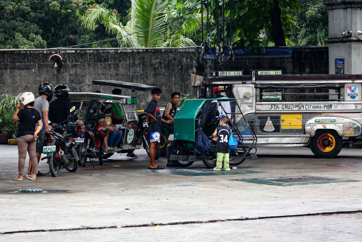 Motorists line up at a gasoline station along Intramuros in Manila on Monday, March 9, 2026, a day before the implementation of staggered fuel price adjustments. (John Louie Abrina)