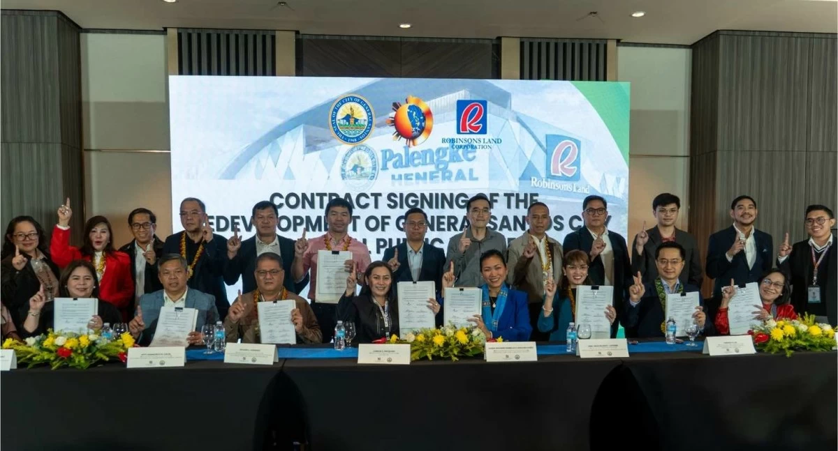 Public and private sector leaders formalize the Palengke Heneral public-private partnership agreement, signaling a joint commitment to infrastructure development in General Santos City. The project reflects the collaboration between the local government and Robinsons Land Corp. to modernize the city’s central trading district with solar-powered facilities and enhanced retail spaces.