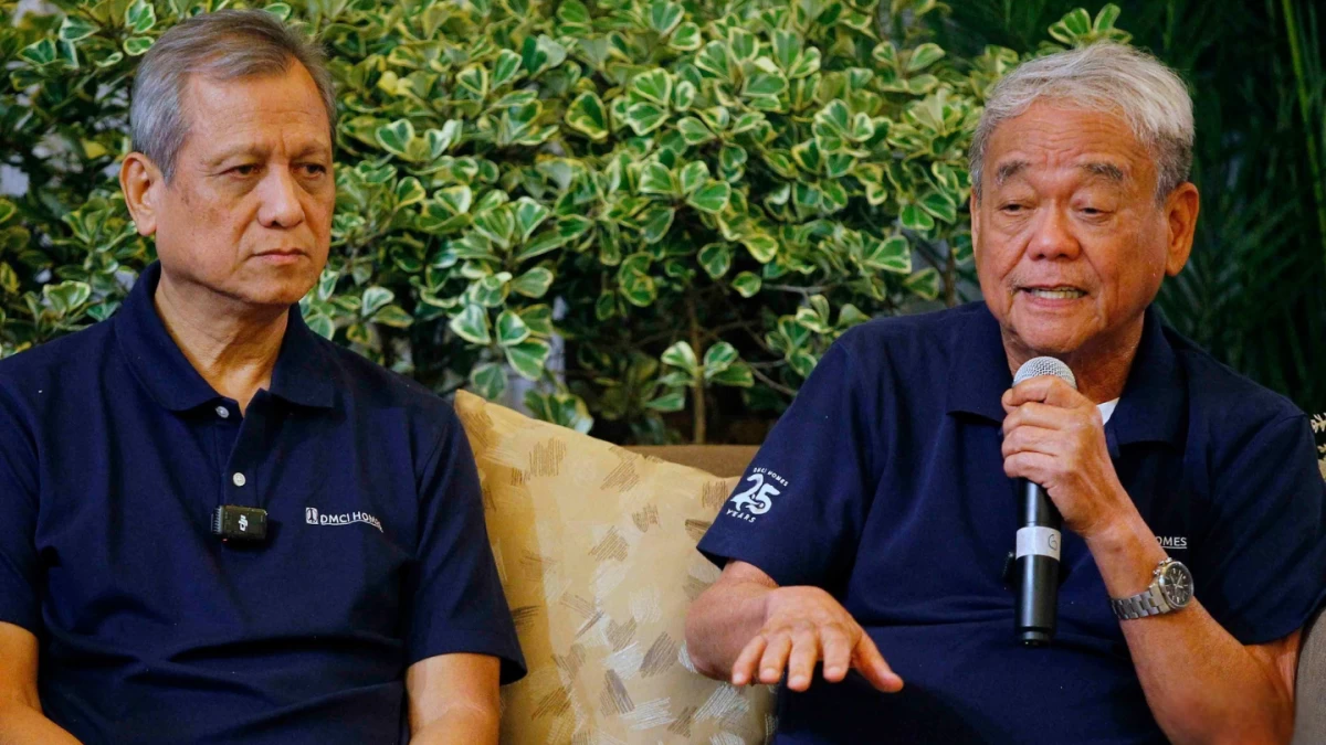DMCI Holdings Inc. Chairman and CEO Isidro A. Consunji, left, and DMCI Homes President Alfredo R. Austria discuss the ₱4.5 billion expansion of Acacia Estates during a briefing at Casa Real in Taguig City on Wednesday, March 11. The company plans to double the township's residential capacity to 20,000 units by 2028. (Photo by Mark Balmores I MB)