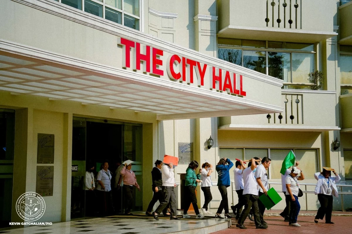 Employees of Valenzuela City Hall participate in the National Simultaneous Earthquake Drill (NSED) on Thursday, March 12. (Photo from Valenzuela City LGU)