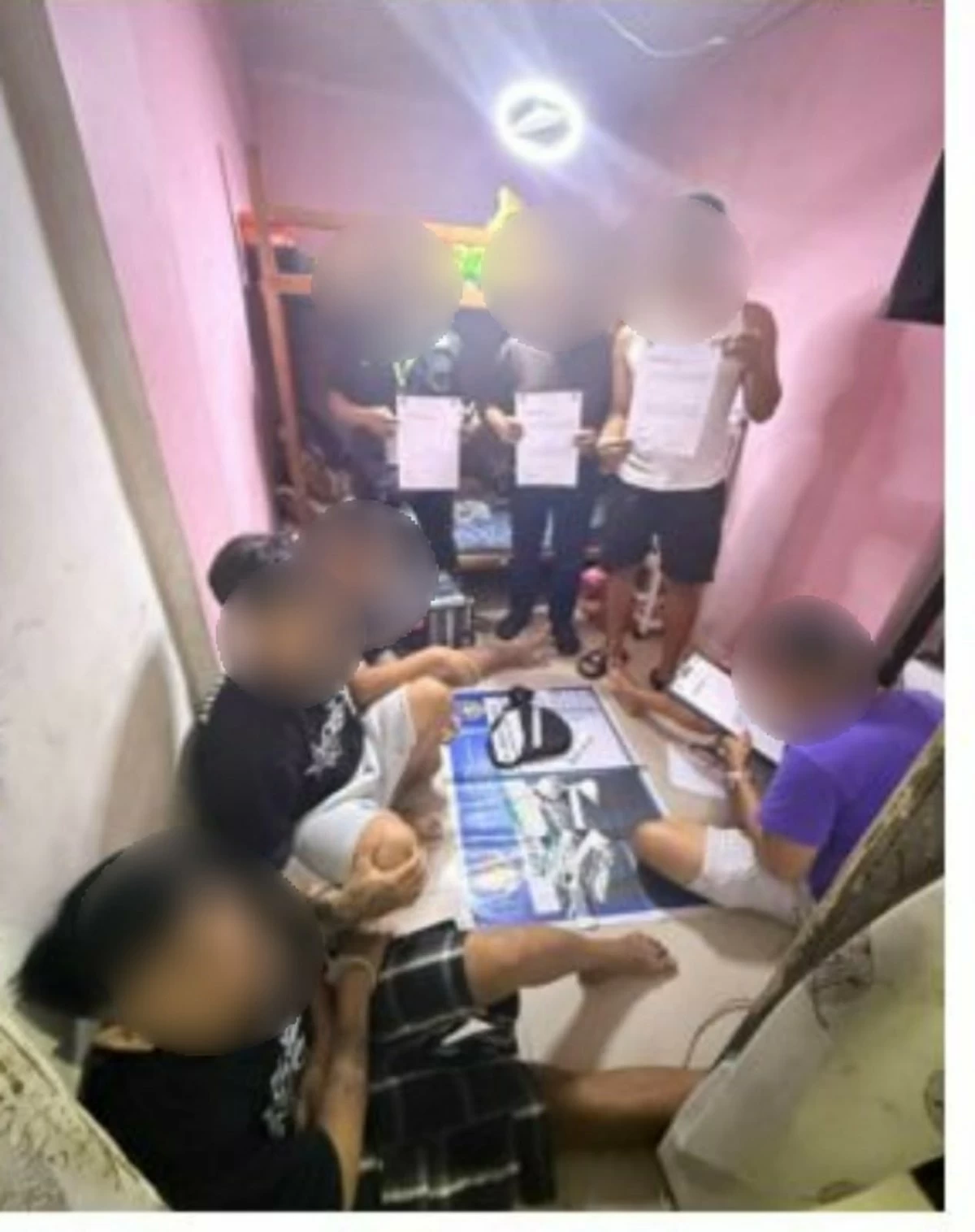 The arrested suspects (seated) (Photo from SPD)