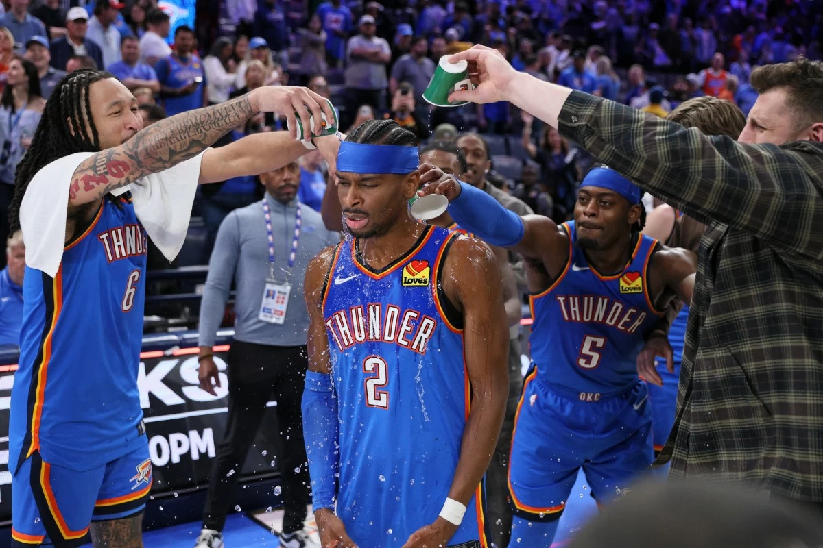 Oklahoma City Thunder forward Jaylin Williams (6), Thunder guard Luguentz Dort (5) and Thunder center Isaiah Hartenstein, right, pour water on Thunder guard Shai Gilgeous-Alexander (2) after an NBA basketball game against the Boston Celtics, Thursday, March 12, 2026, in Oklahoma City. (AP Photo/Nate Billings)