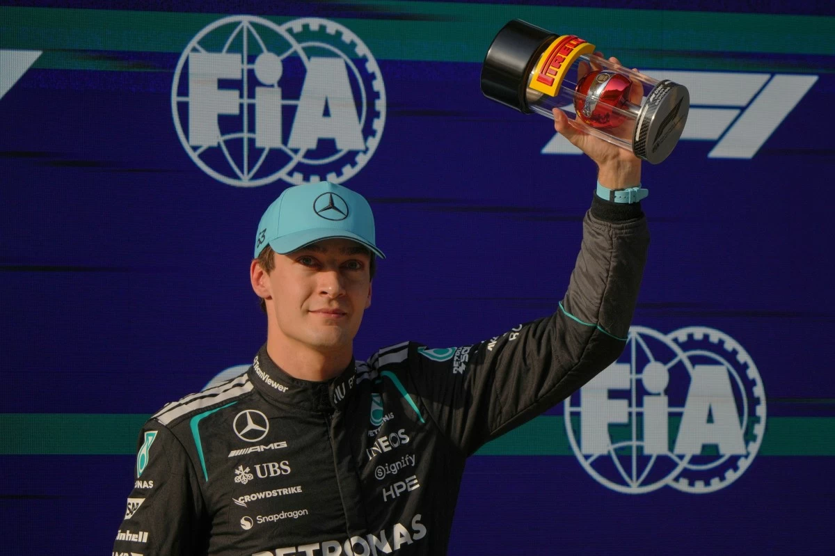 Mercedes driver George Russell of Britain celebrates his pole position for the sprint qualifying ahead of the Chinese Formula One Grand Prix race in Shanghai, China, Friday, March 13, 2026. (AP Photo/Andy Wong)