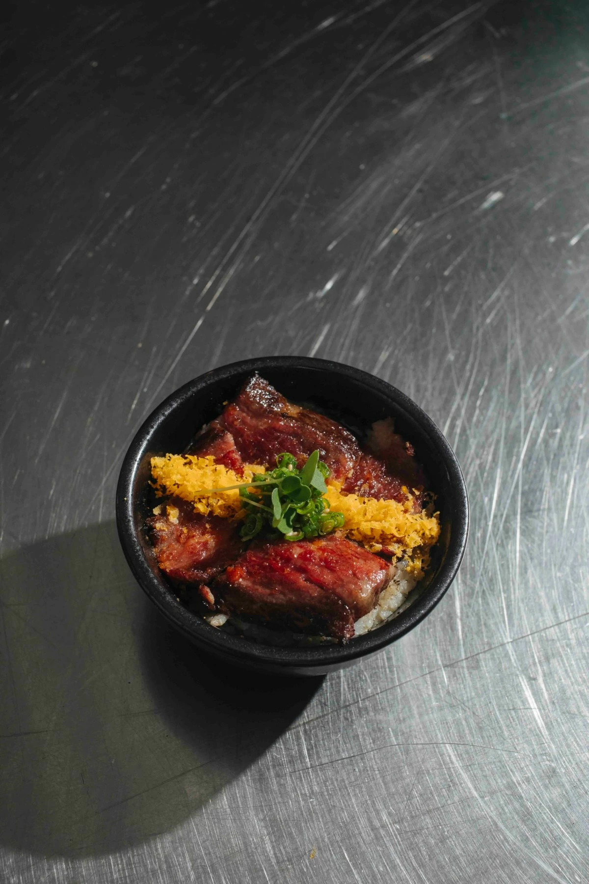 STEAK DONBURI A5 Wagyu striploin served over gohan and finished with furikake.