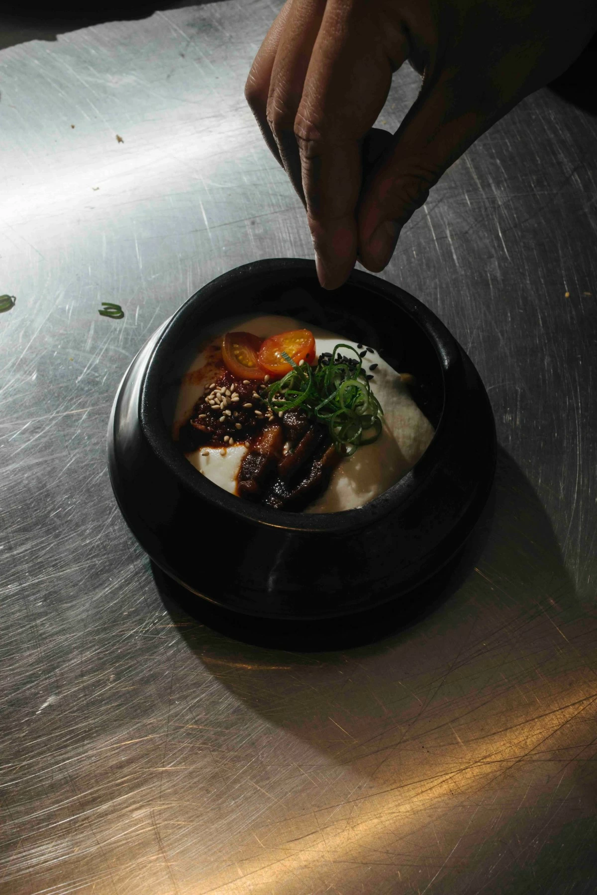 YUZU ABURASOBA Aburasoba tossed with yuzu, guanciale, egg yolk, and parmesan foam, topped with nduja salsa.